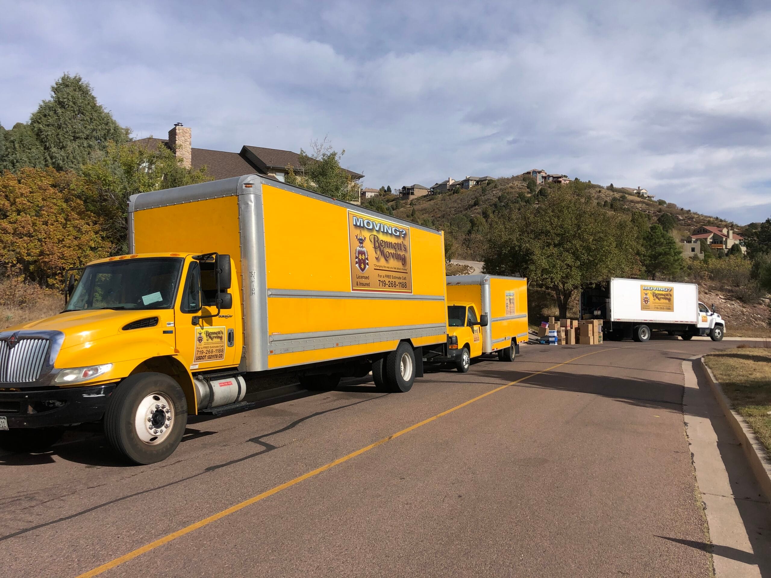 Bennett's Moving trucks outside a Colorado Springs home during a move