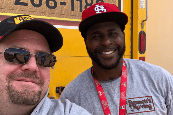 Bennett's Moving crew members in company shirts in front of a Bennett's Moving truck
